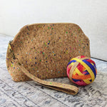 cork knitting project bag with colourful speckles and self striping yarn ball